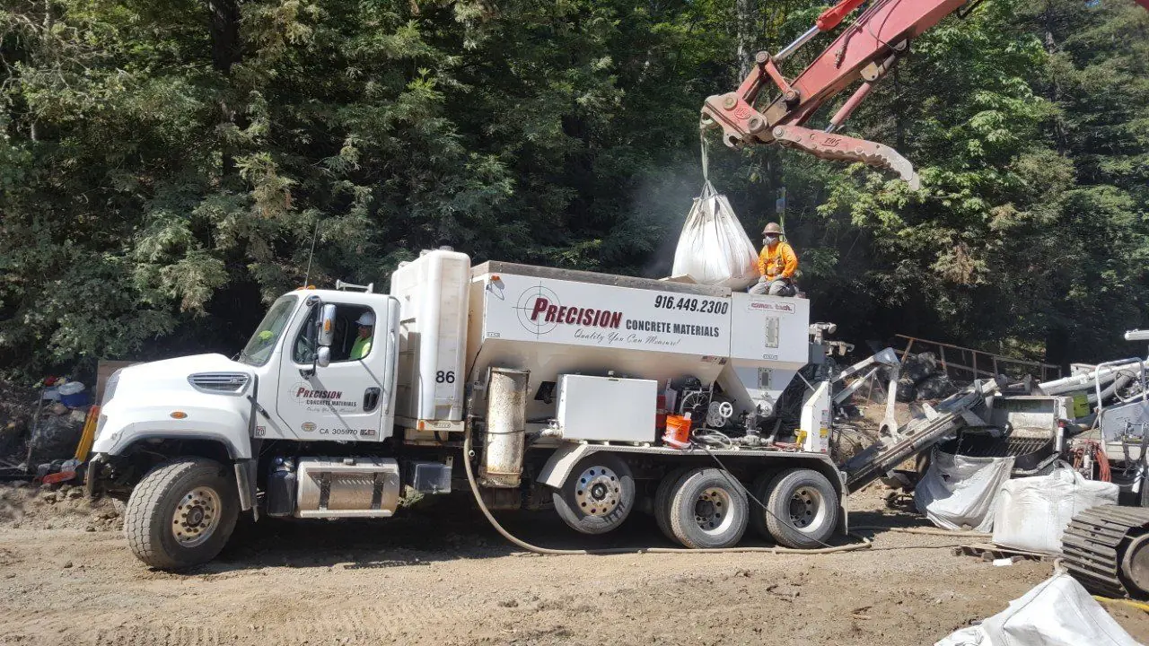 Volumetric mixer and crane on a commercial concrete pour.