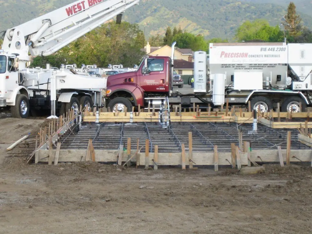Crew placing concrete for a foundation pour