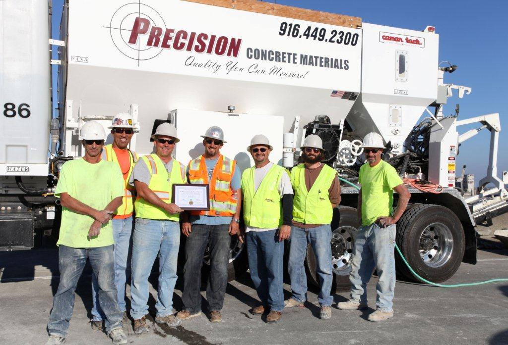 7 Precision Concrete Materials Employees In A group Picture