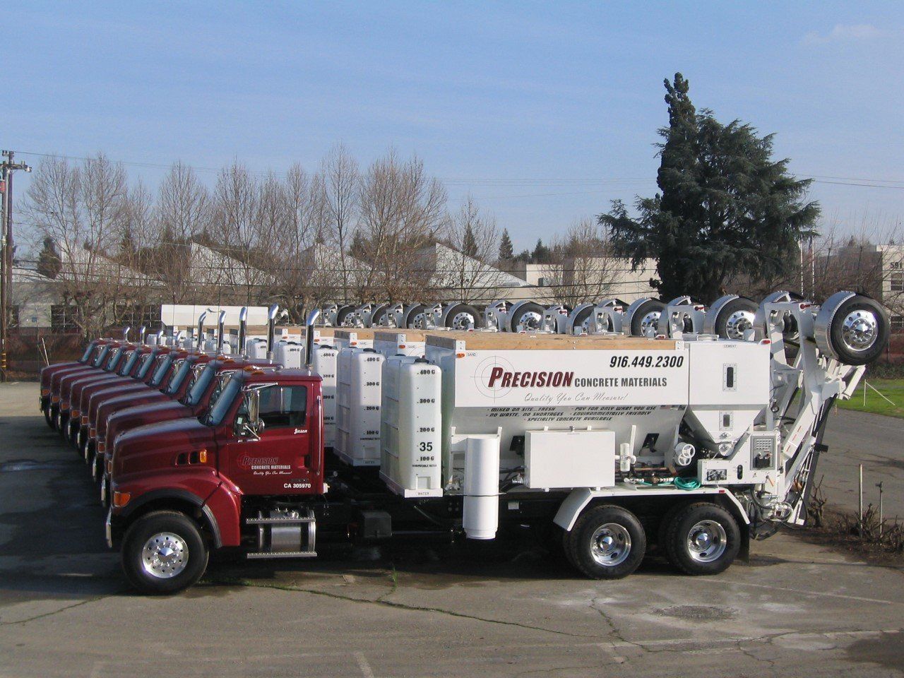 Image of 9 Precision Concrete Materials Trucks Lined up Side By Side
